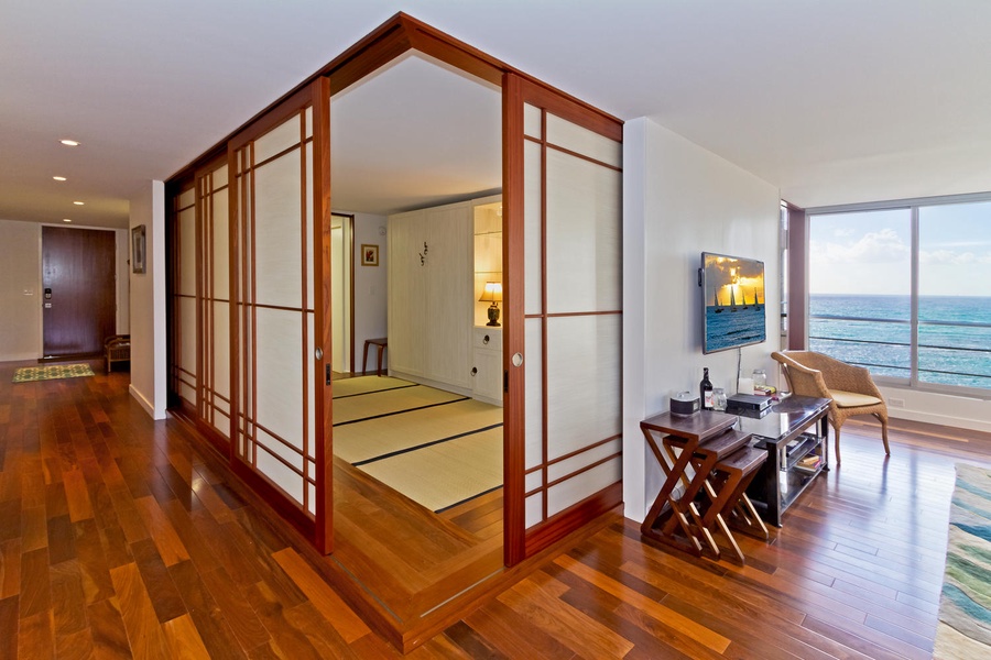 Guest bedroom opens up to living room.