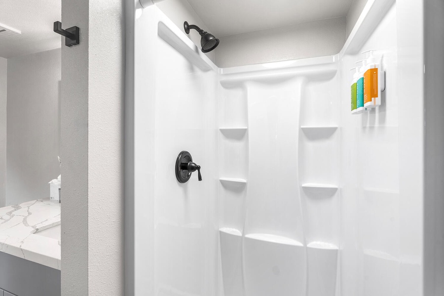 Walk-in shower for a refreshing rinse after beach days.