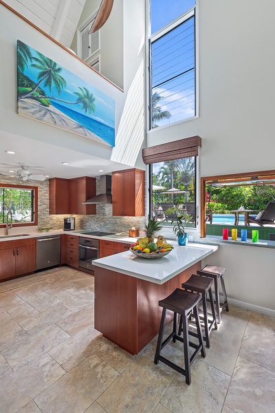 Pool House chef’s kitchen and bar with modern appliances and a breakfast counter seating 3.