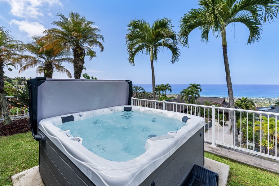 Soak in your private hot tub with stunning ocean views framed by tropical palms—pure paradise awaits.
