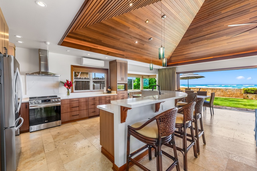 Center island and vaulted ceiling enhance this airy kitchen, ideal for hosting or enjoying quiet meals.