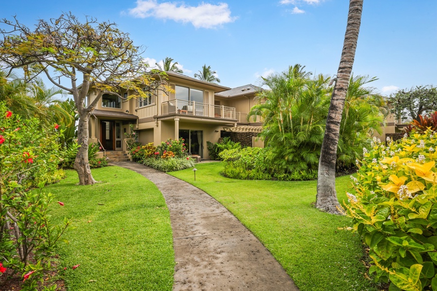 Elegant landscaped entryway to this spectacular split level Ke Alaula villa.