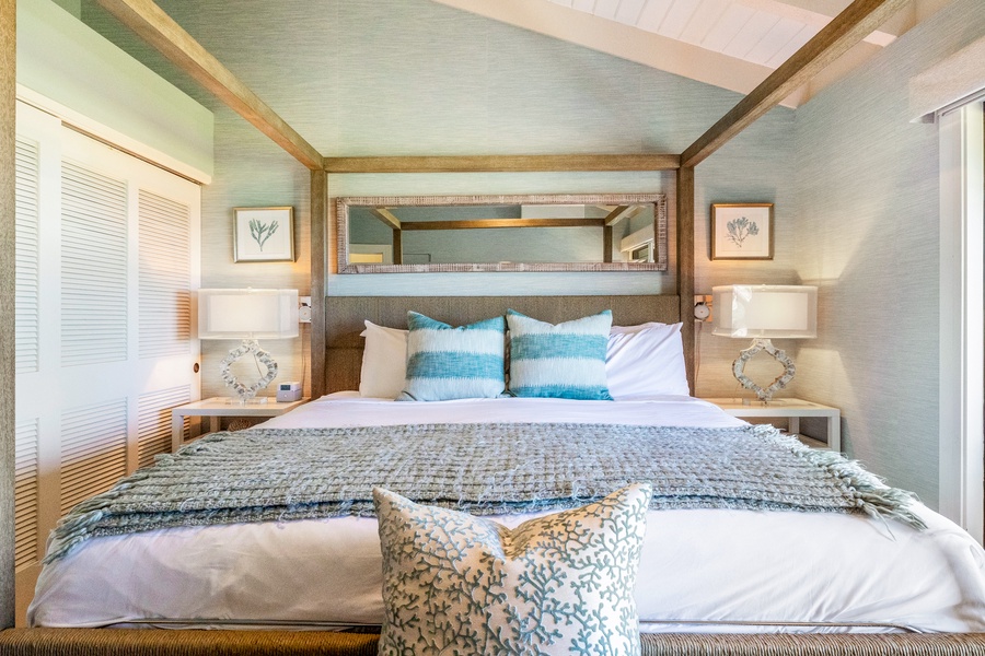 Relax in this serene bedroom with coastal decor and plush linens.