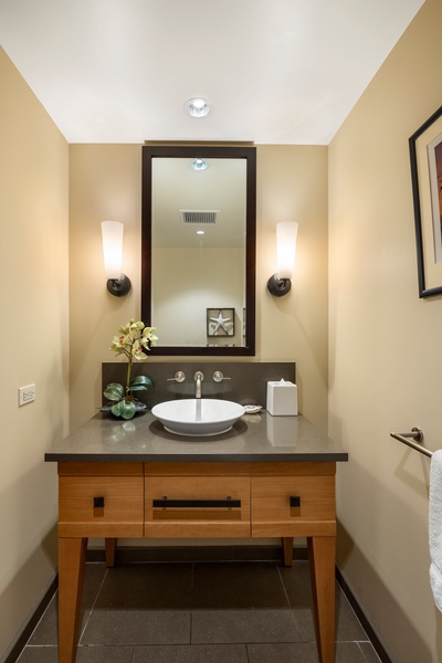 Shared bathroom with a single vanity.