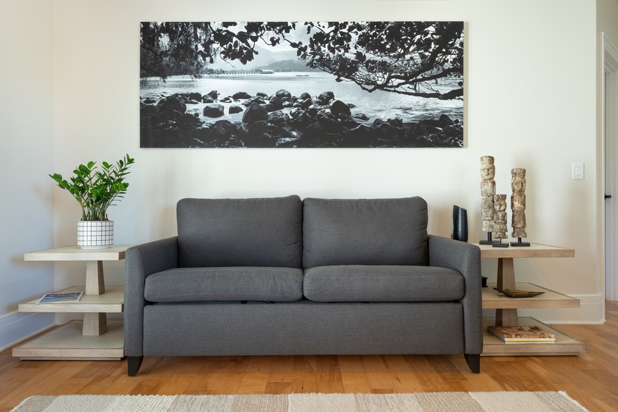 Comfortable sitting area with a sleek gray sofa and modern decor.