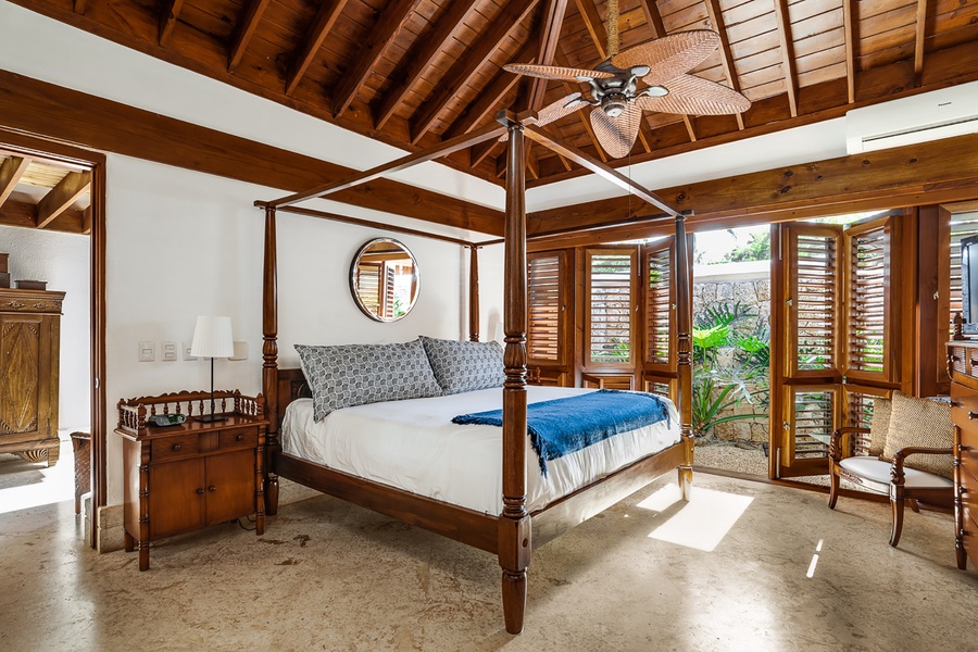 Retreat to the primary suite with a king bed, split AC and lanai.