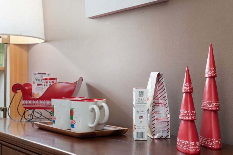 Charming holiday mugs and decor add a playful touch to your kitchen essentials.