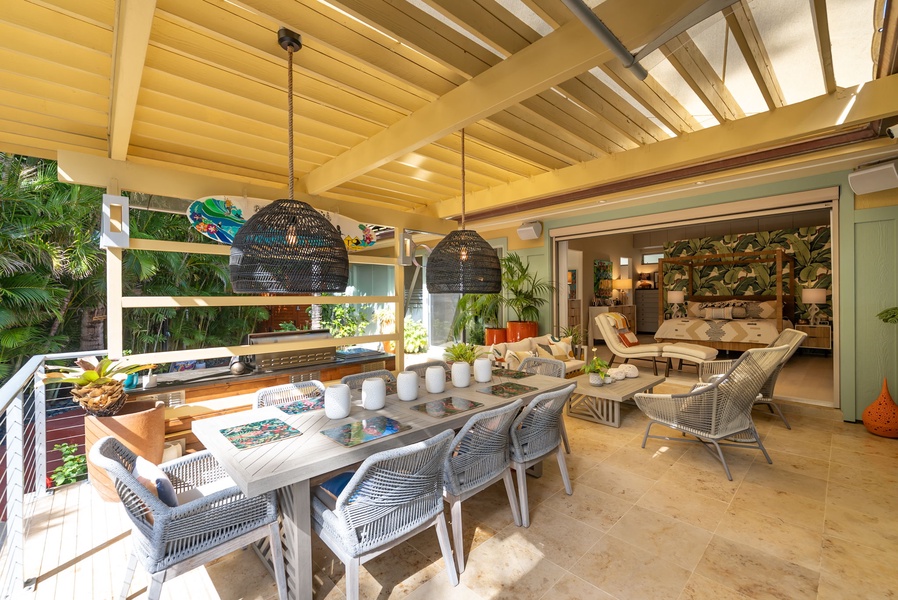 Elegant outdoor dining table with pendant lighting and garden views for unforgettable meals.