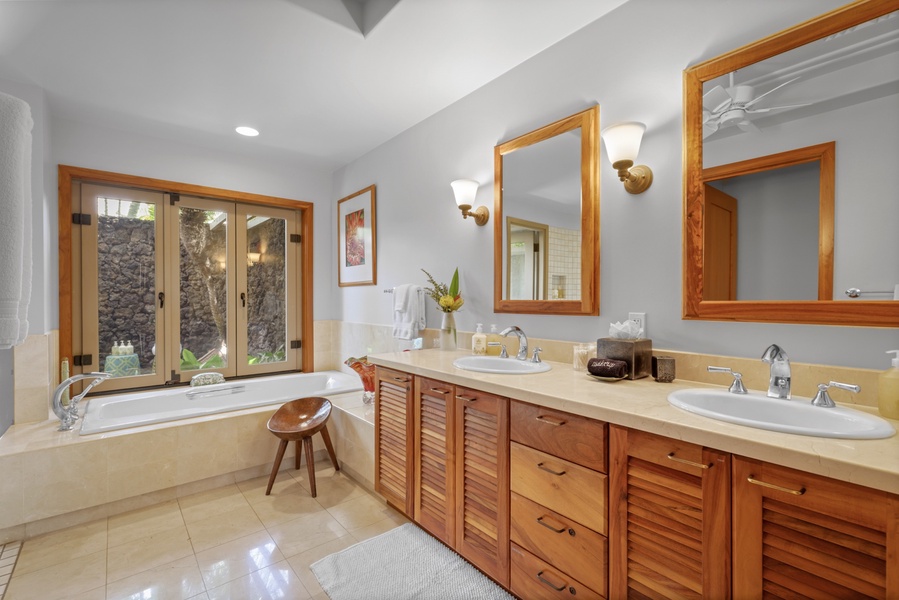 Deluxe primary bath w/oversized soaking tub, separate walk-in shower & tropical outdoor shower.
