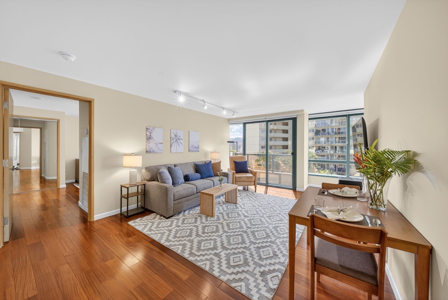 Enjoy easy indoor-outdoor living with plush seating and a private lanai beyond.