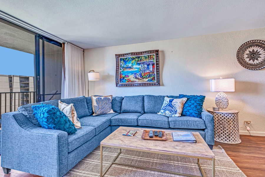 Curl up on the plush sectional in the cozy living area at Kaanapali Shores 746 after a day of adventure.