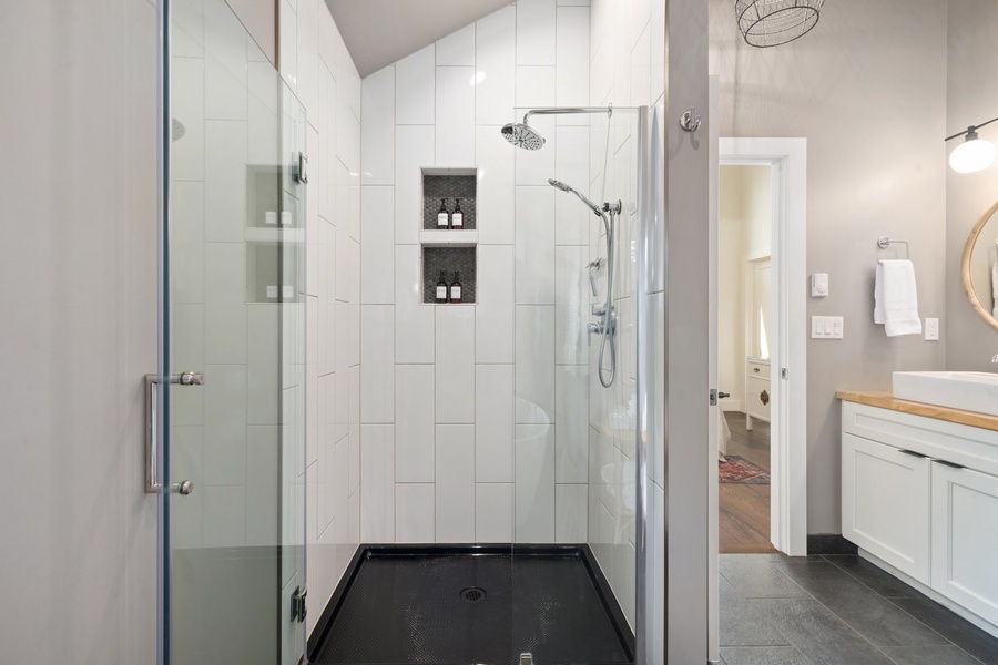 Walk-in shower with clean tile and a rain head for a spa-like feel.