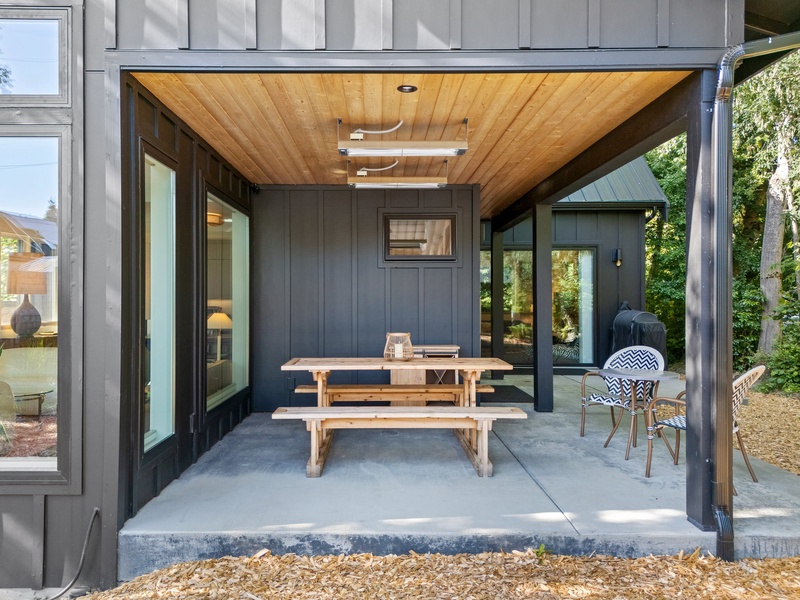 Enjoy covered outdoor dining year-round with a picnic table and heater.