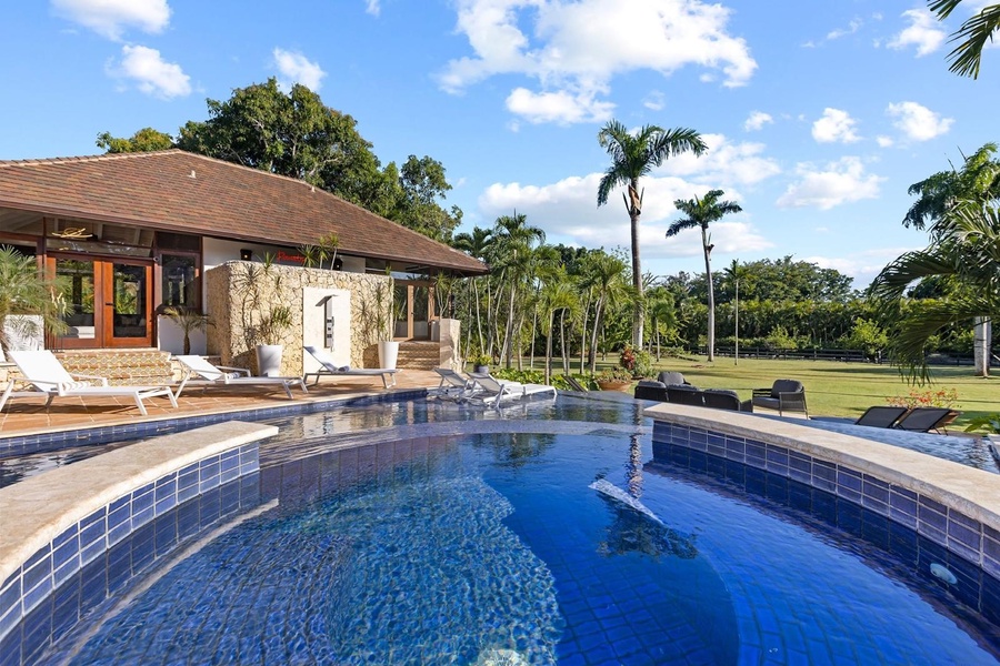 Take a refreshing dip in the pool with breathtaking views of the vast natural surroundings.