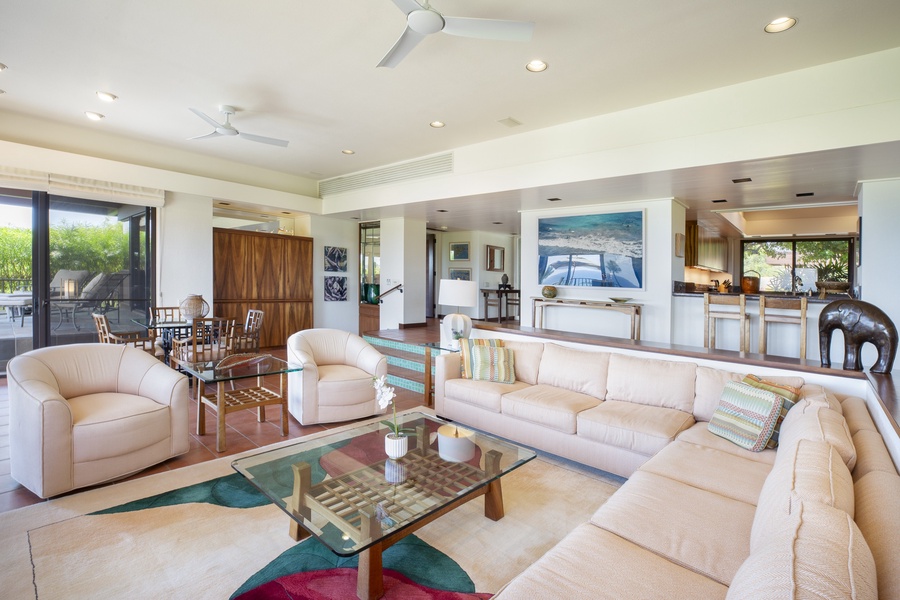 Expansive living room with ocean views, seamlessly blending indoor comfort with tropical island beauty.