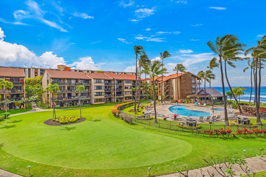 Overlooking the lush lawn and resort pool, the lanai provides a perfect vantage point to soak in the vibrant tropical atmosphere and ocean views.