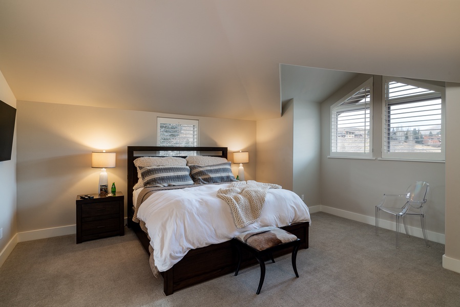 The upper level houses two additional bedrooms, each boasting king-size beds, en-suite bathrooms, and all the comforts you'd expect.