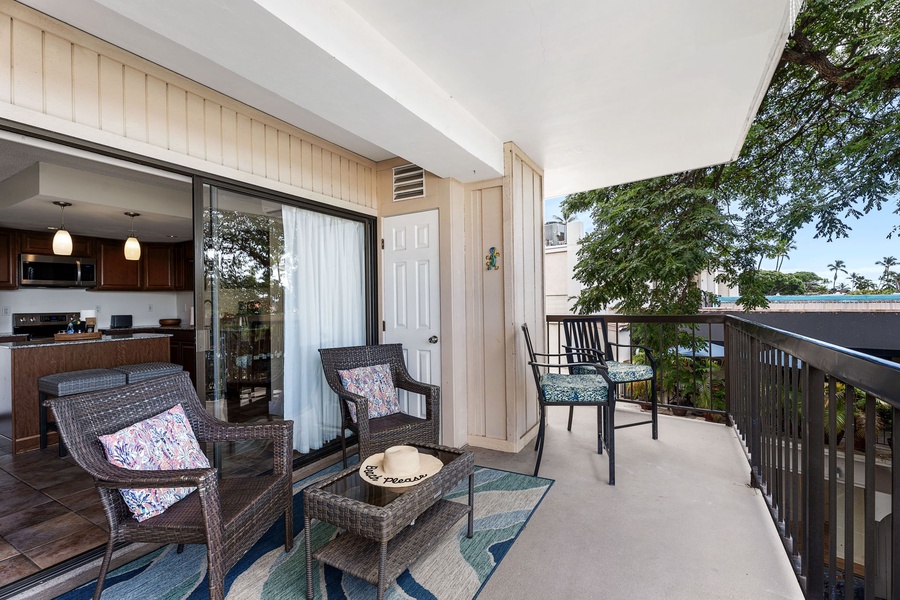 Private lanai with lush greenery, a great spot for morning coffee or sunset cocktails.