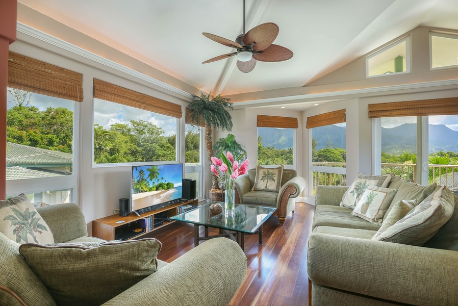 The bright and cozy living room has scenic views and plush seating.
