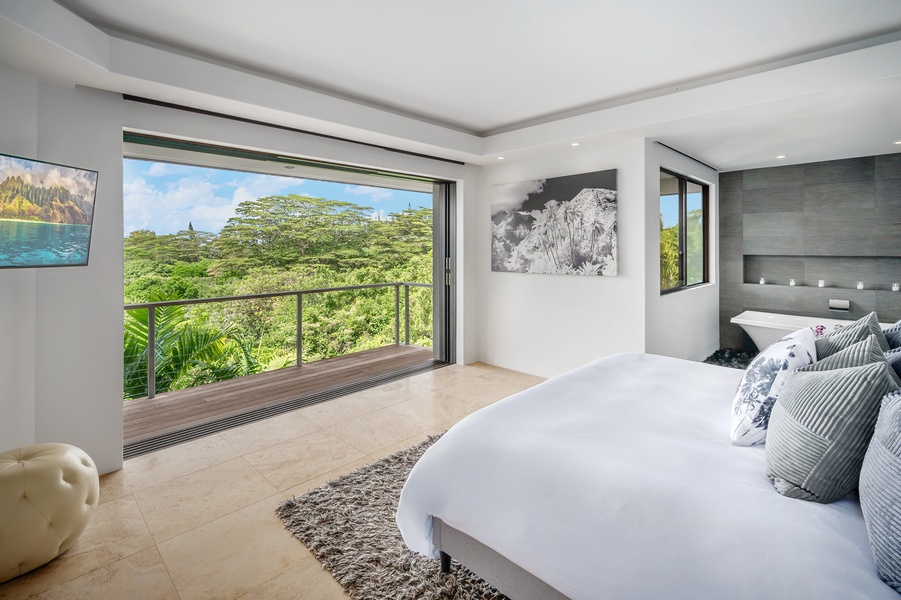 Primary suite with expansive windows and breathtaking views, bringing the beauty of nature indoors.