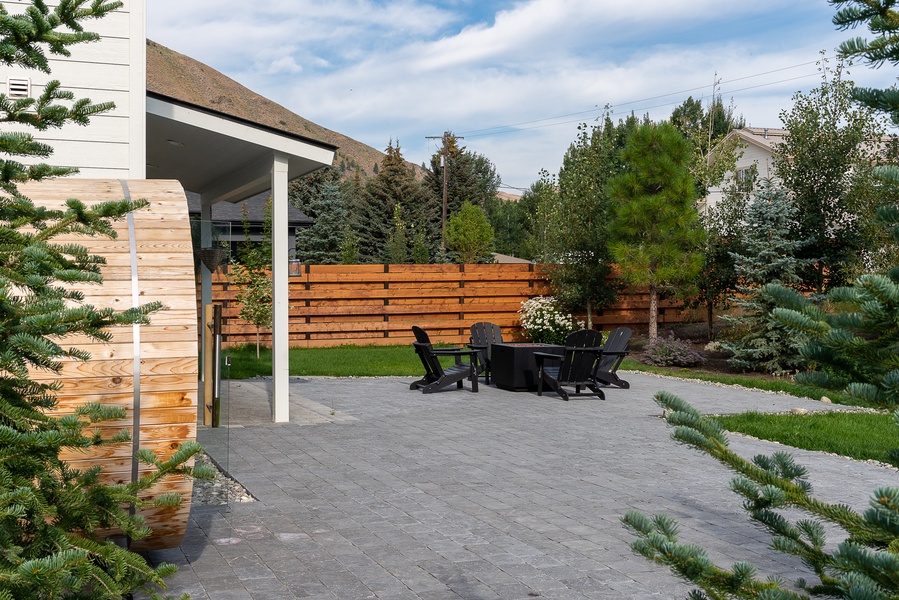 The backyard and patio have lots of fun to offer with a sauna and fire pit