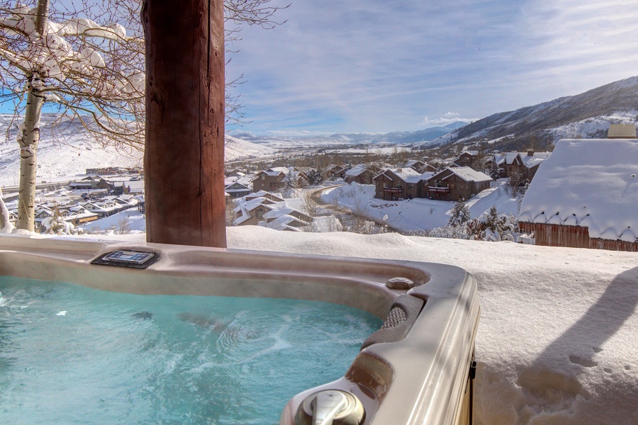 Welcome to this hilltop Luxury Home with Panoramic Views and Private Hot Tub!