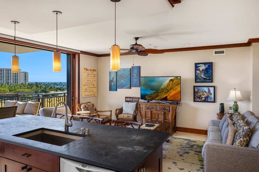 Beautifully furnished living room that overlooks the kitchen.