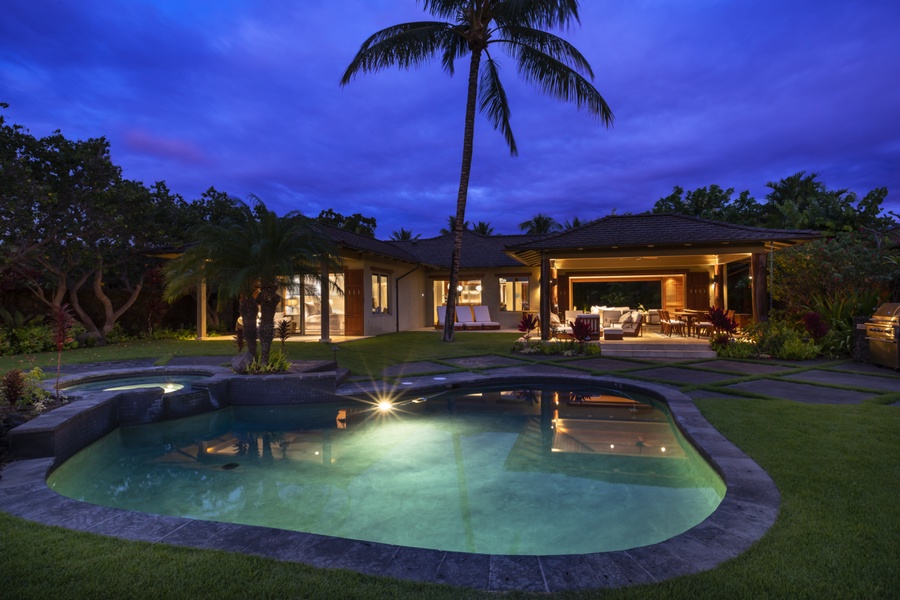 View of the private pool & spa at twilight, with the main lanai & primary bedroom lanai beyond
