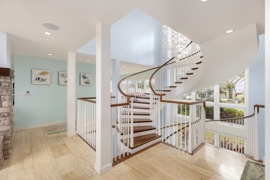 The staircase leads you upstairs where you'll find four bedrooms