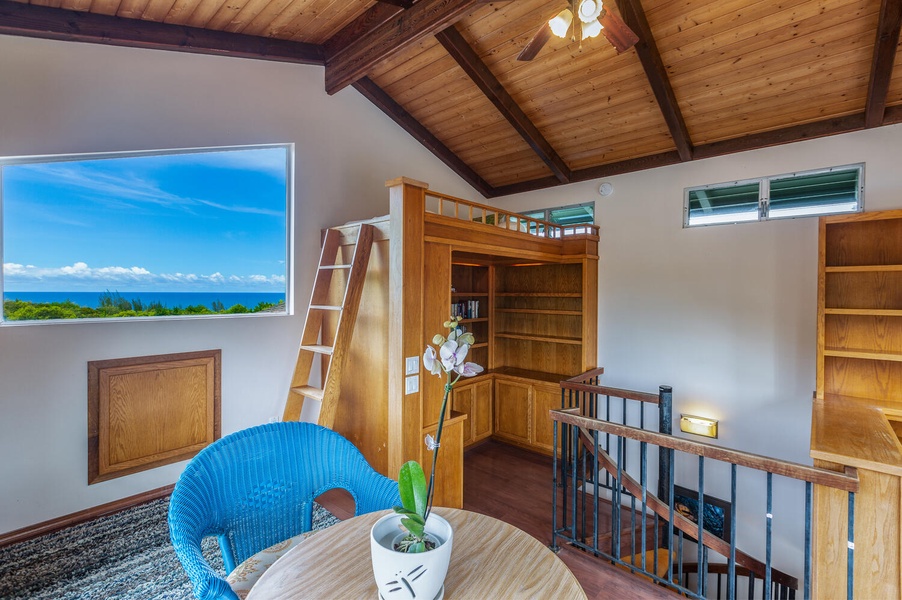 Up the spiral staircase, you'll find Guest Bedroom 3 with a lofted twin bed and play area for the kids