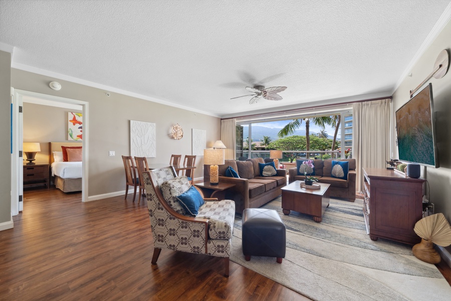 Gather with friends and family in the warm and inviting great room of Honua Kai Konea 204, with seamless indoor-outdoor access.