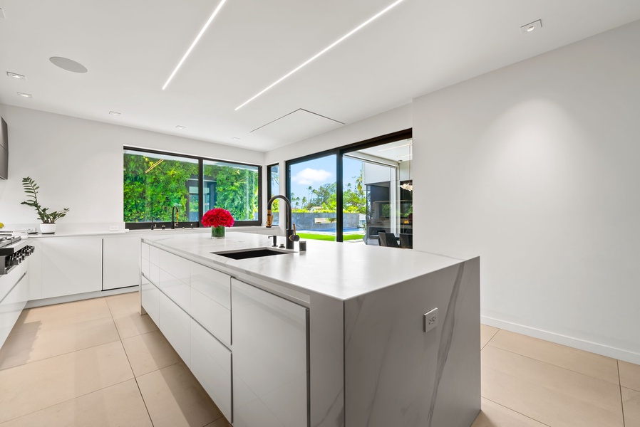 The waterfall island provides plenty of space, with garden views to take in through expansive glass.