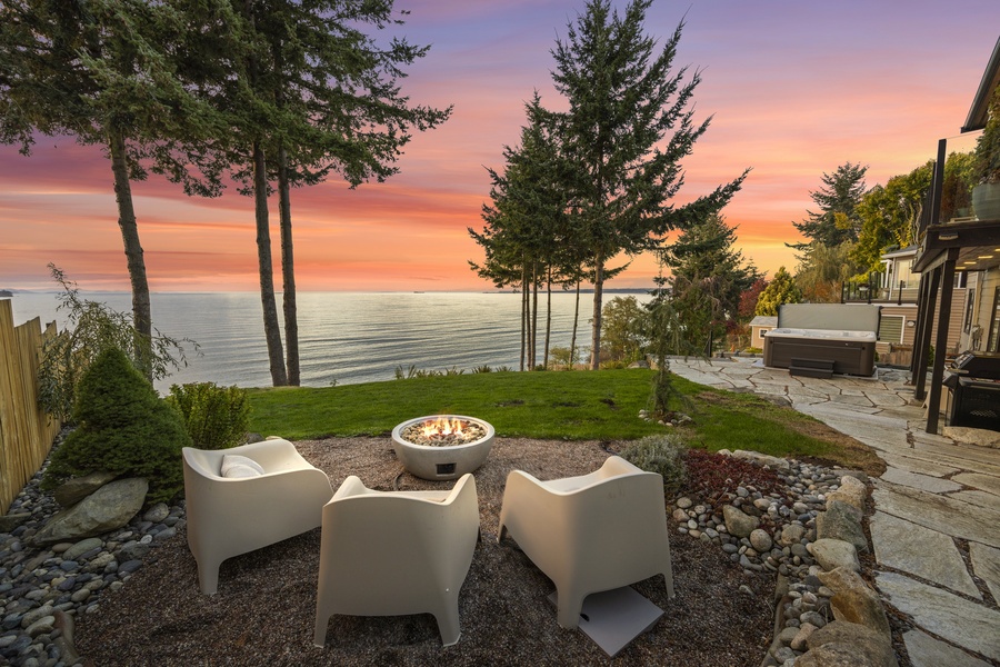 Golden skies and crackling firelight — the perfect Pacific Northwest sunset moment right from your private yard.