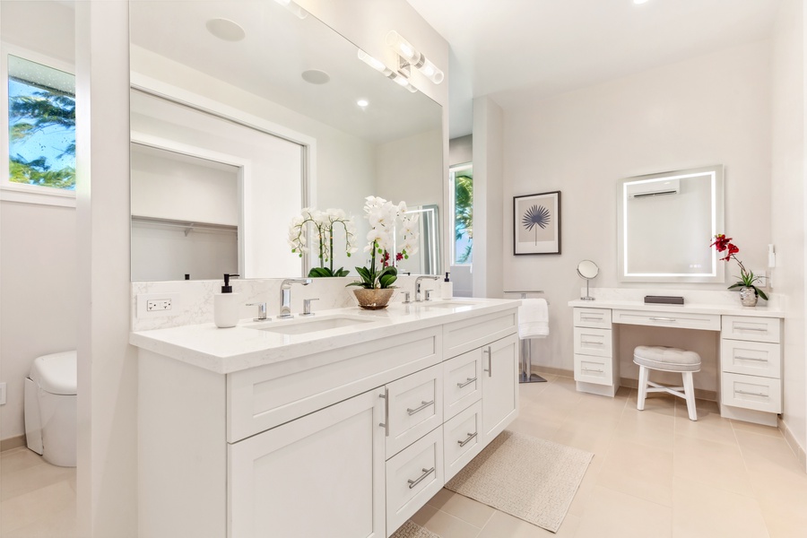 Bathroom with ample counter space and luxurious touches for a serene morning routine.