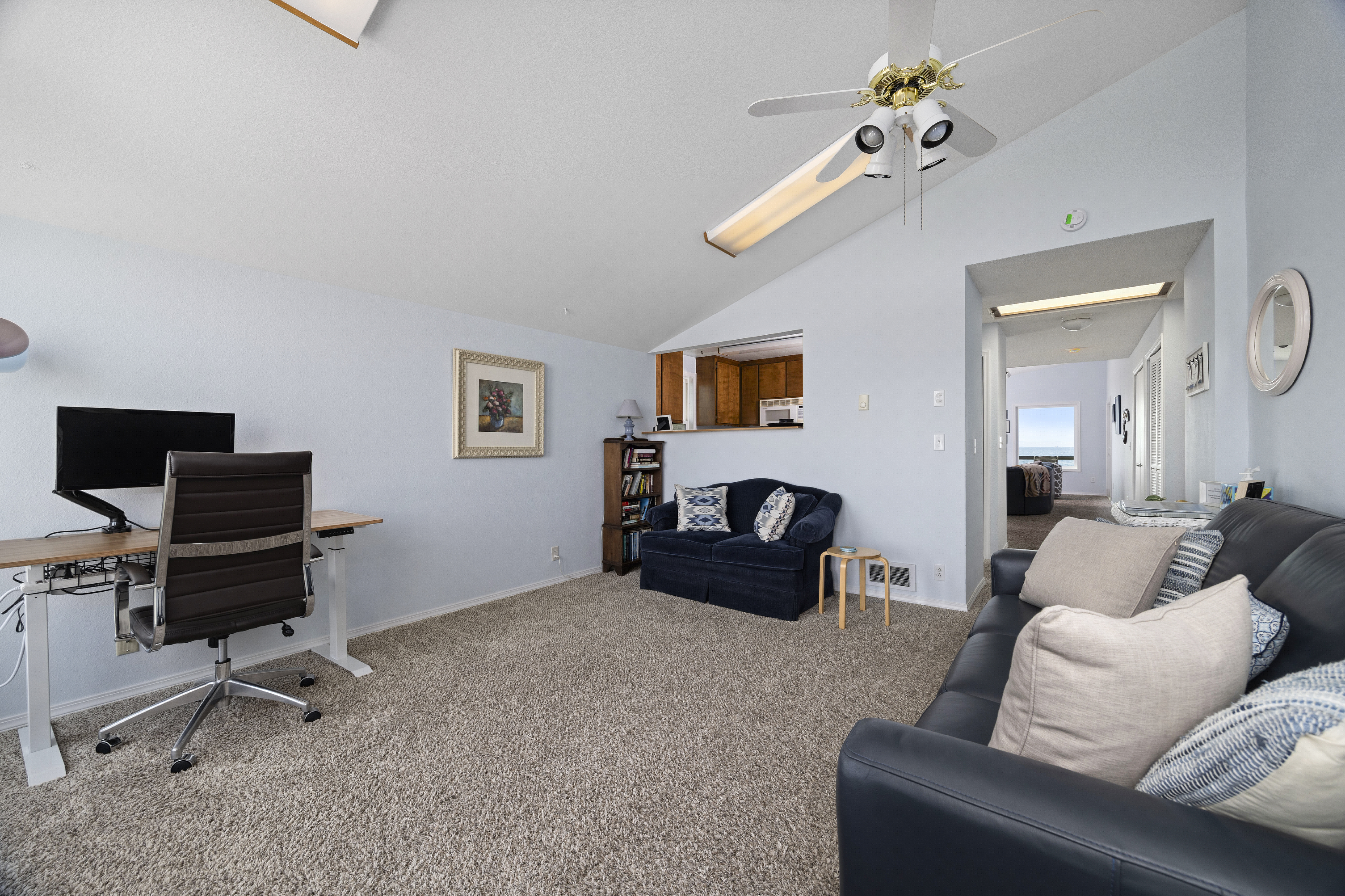 Spacious second sitting area with plenty of seating and a seamless connection to the kitchen.