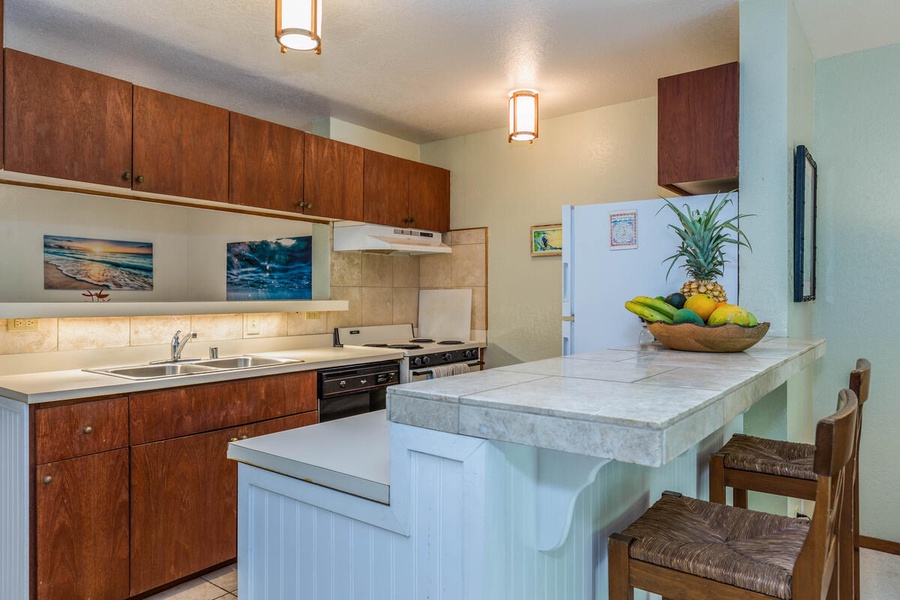The well-equipped kitchen is large for its galley-style, and has a sizable storage pantry off to the side to store snacks you pick during your stay