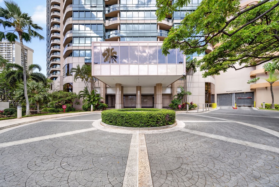 Arrive at Waikiki Landmark with secure entry and tropical landscaping throughout.