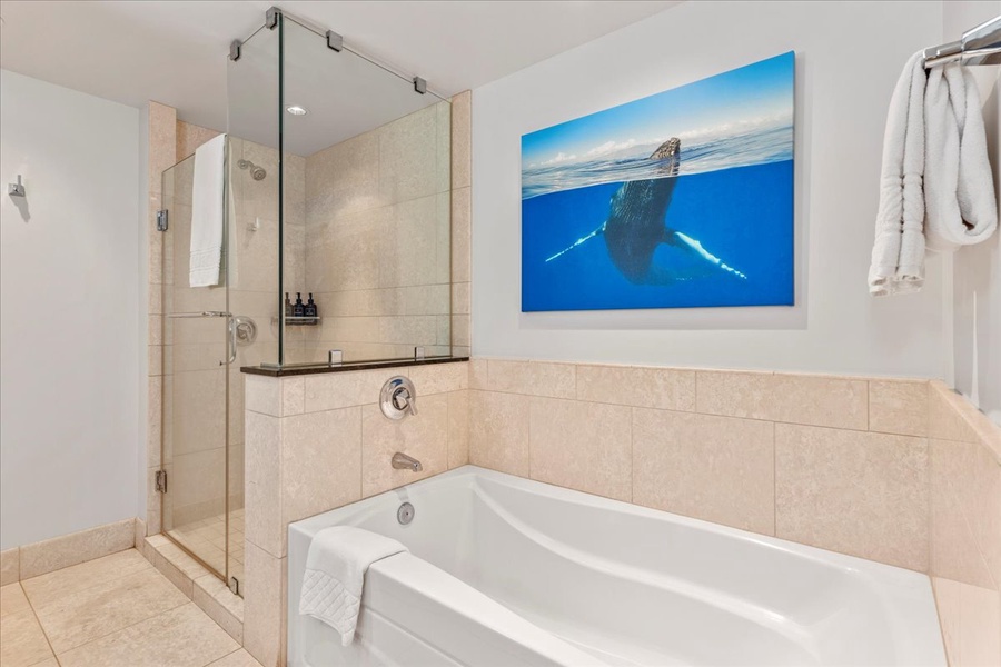Spa-like bath at Honua Kai Hokulani 825, featuring a soaking tub and walk-in shower.