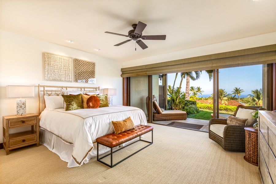 Spacious ocean view primary suite with private lanai, flat screen TV, walk-in closet and ensuite bath.
