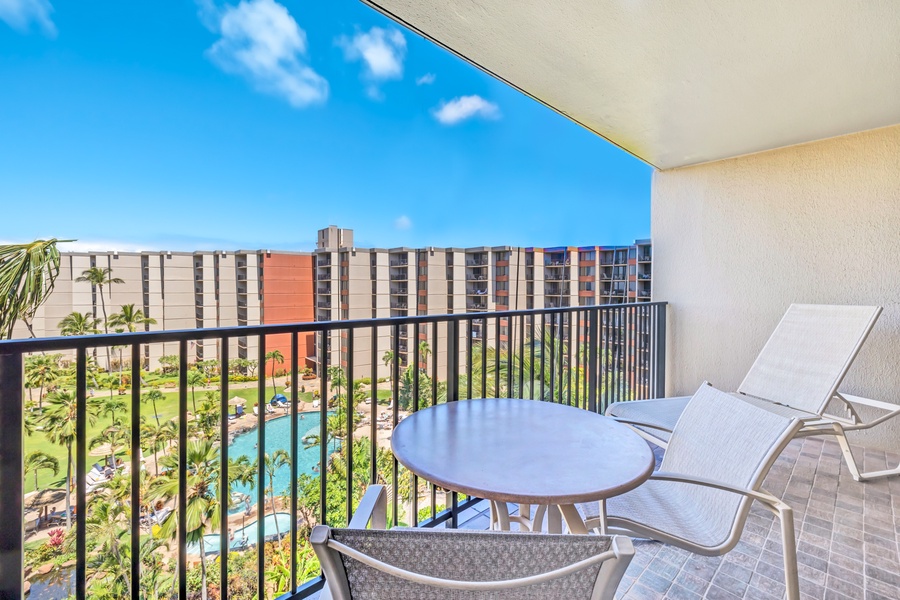 The lanai offers a comfortable seating area with views of the resort and pool.