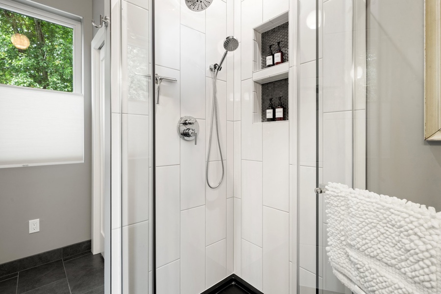 Compact walk-in shower and all essentials close at hand.