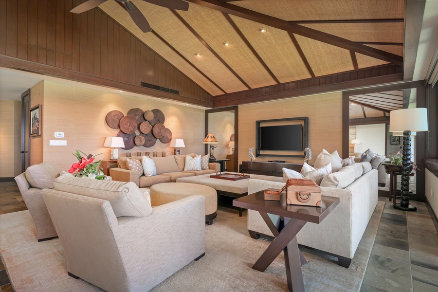 Evening glow and custom lighting elevate the elegant open-concept space—comfort with artistic flair.
