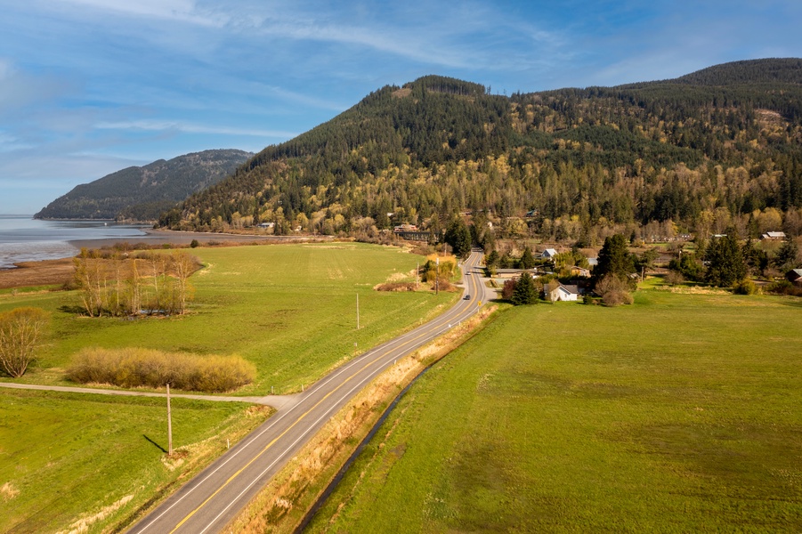 Sweeping view of the misty coastal railway surrounded by forested hills, perfect for exploring the area.