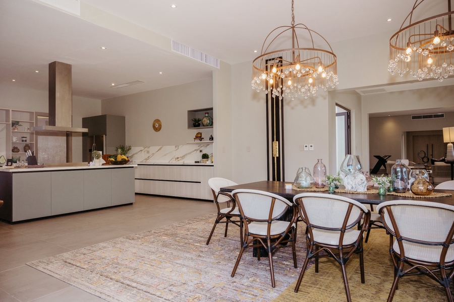 Open-concept kitchen and dining space with sleek countertops and plenty of natural light.