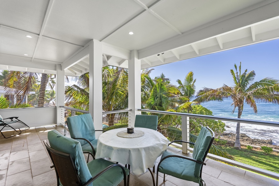 Upstair lanai with alfresco dining and peaceful garden surroundings.
