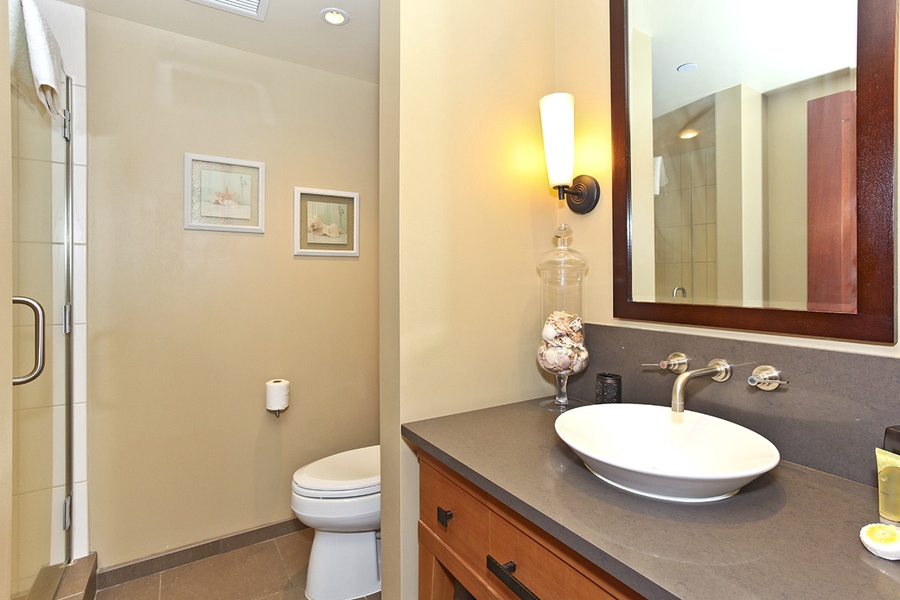 The third guest bathroom features a shower and stylish vanity.