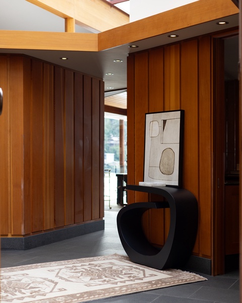 You'll love this modern lobby's striking architecture with rich wood panels and sculptural furniture creating an elegant first impression.