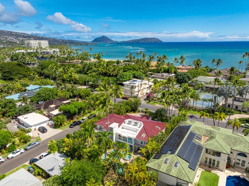 Aerial view showcasing the villa and its scenic surroundings, close to the coast and local attractions.