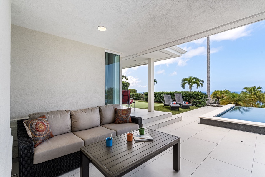 Comfortable outdoor sectional perfect for lounging after a dip, with ceiling coverage and ocean breeze.