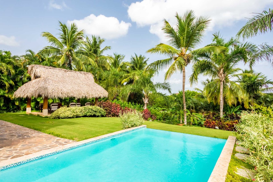 Plunge into the private pool and enjoy the tropical view.